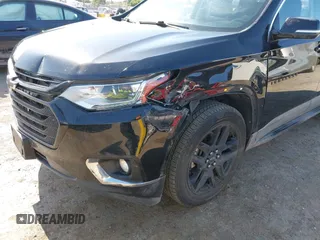 2019 Chevrolet Traverse LT Cloth z VIN 1GNEVGKW7KJ208656, wystawiony jako IAAI lot #42373422 z przebiegiem 132 863 mil mil oraz . Historia ofert i sprzedaży dostępna na DreamBid. Obrazek 6.
