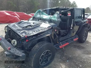 2015 Jeep Wrangler Unlimited Rubicon z VIN 1C4BJWFG7FL711036, wystawiony jako IAAI lot #41604648 z przebiegiem 167 678 mil mil oraz . Historia ofert i sprzedaży dostępna na DreamBid. Obrazek 6.