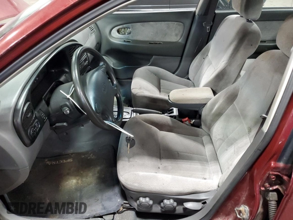 2003 Kia Spectra with VIN KNAFB121735217341, listed as a Copart auction lot 72016504 with 116,224 mi miles and Salvage Title. Bid and sale history available at DreamBid. Image 7.