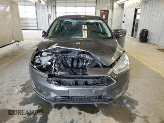 2017 Ford Focus SE z VIN 1FADP3F24HL319991, wystawiony jako Copart lot #47522025 z przebiegiem 92 997 mil mil oraz Czysty tytuł • Clean title. Historia ofert i sprzedaży dostępna na DreamBid. Obrazek 5.