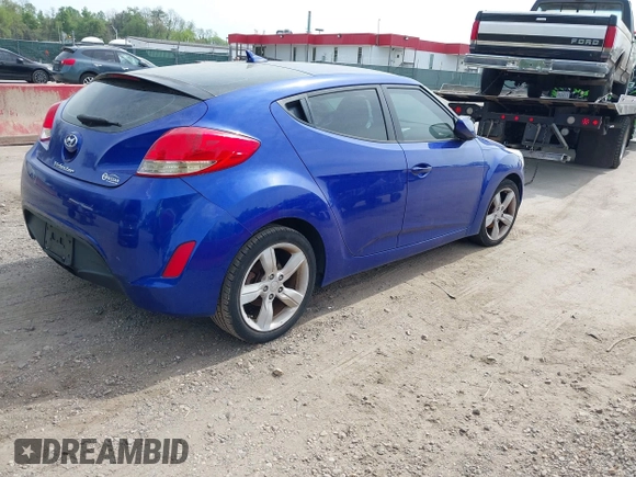 2014 Hyundai Veloster with VIN KMHTC6AD2EU184927, listed as a IAAI auction lot 42133499 with 103,499 mi miles. Bid and sale history available at carsss.com. Image 4.