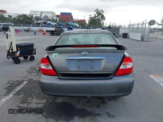 2004 Toyota Camry LE with VIN 4T1BF32K84U588764, listed as a IAAI auction lot 42126345 with 144,642 mi miles. Bid and sale history available at carsss.com. Image 16.