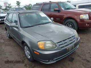2004 Hyundai Accent GL z VIN KMHCG45C04U502892, wystawiony jako IAAI lot #42309078 z przebiegiem 127 362 mil mil oraz . Historia ofert i sprzedaży dostępna na DreamBid. Obrazek 1.