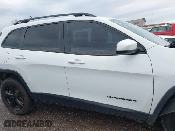 2016 Jeep Cherokee Latitude with VIN 1C4PJMCSXGW214243, listed as a IAAI auction lot 40850362 with 96,240 mi miles and . Bid and sale history available at carsss.com. Image 13.