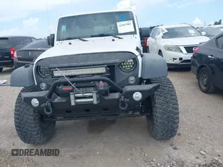 2011 Jeep Wrangler Unlimited Rubicon with VIN 1J4BA6H10BL536027, listed as a IAAI auction lot 42567901 with 164,487 mi miles and . Bid and sale history available at DreamBid. Image 12.