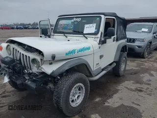 2005 Jeep Wrangler Sport with VIN 1J4FA49S25P320240, listed as a IAAI auction lot 41433371 with 144,552 mi miles. Bid and sale history available at carsss.com. Image 19.