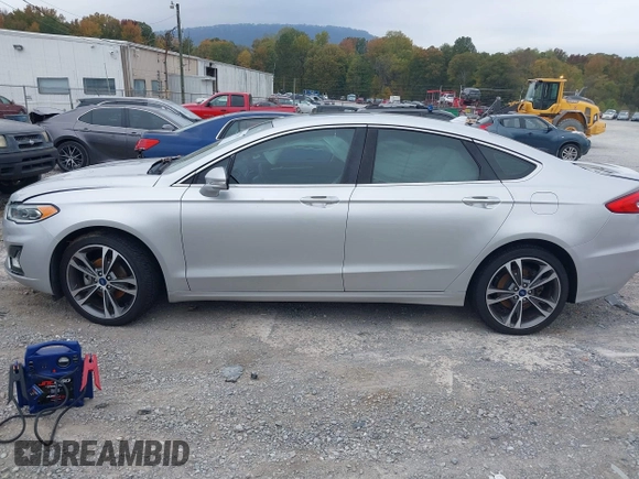 2019 Ford Fusion Titanium with VIN 3FA6P0K96KR120749, listed as a IAAI auction lot 40737085 with 118,376 mi miles and . Bid and sale history available at DreamBid. Image 14.