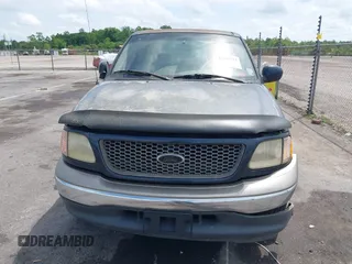2001 Ford F-150 XLT z VIN 1FTRW07W61KA23644, wystawiony jako IAAI lot #42162523 z przebiegiem 203 636 mil mil oraz . Historia ofert i sprzedaży dostępna na DreamBid. Obrazek 6.