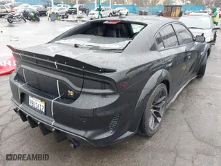 2022 Dodge Charger Scat Pack Widebody with VIN 2C3CDXGJ4NH159524, listed as a IAAI auction lot 41506983 with 66,750 mi miles. Bid and sale history available at carsss.com. Image 4.