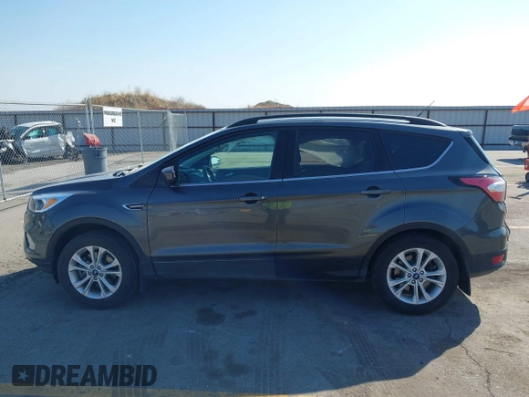 2018 Ford Escape SE z VIN 1FMCU9GD6JUD55937, wystawiony jako IAAI lot #41898592 z przebiegiem 37 800 mil mil oraz . Historia ofert i sprzedaży dostępna na DreamBid. Obrazek 15.