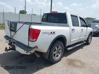 2012 Nissan Titan SL with VIN 1N6BA0EC1CN326919, listed as a IAAI auction lot 42630368 with 230,215 mi miles and . Bid and sale history available at DreamBid. Image 4.
