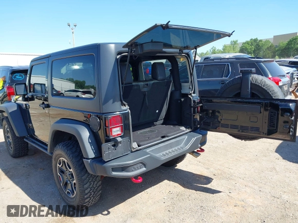 2015 Jeep Wrangler Rubicon Hard Rock with VIN 1C4BJWCG1FL610028, listed as a IAAI auction lot 42318569 with 48,627 mi miles and . Bid and sale history available at DreamBid. Image 3.