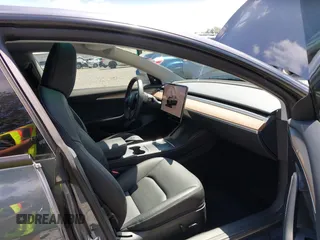 2023 Tesla Model 3 z VIN 5YJ3E1EA6PF650212, wystawiony jako IAAI lot #42554747 z przebiegiem 49 838 mil mil oraz . Historia ofert i sprzedaży dostępna na DreamBid. Obrazek 5.
