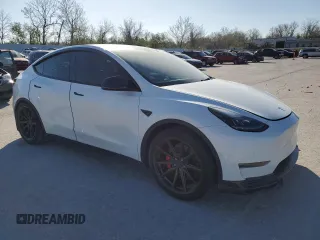 2021 Tesla Model Y Performance with VIN 5YJYGDEF3MF262878, listed as a Copart auction lot 52897595 with 50,939 mi miles and Salvage Title. Bid and sale history available at DreamBid. Image 4.