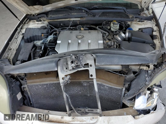 2004 Cadillac DeVille DTS z VIN 1G6KF57924U185324, wystawiony jako Copart lot #58222205 z przebiegiem 182 640 mil mil oraz Szkoda całkowita • Salvage title. Historia ofert i sprzedaży dostępna na DreamBid. Obrazek 11.