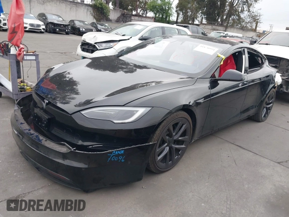 2022 Tesla Model S with VIN 5YJSA1E55NF474342, listed as a IAAI auction lot 41870994 with 33,804 mi miles and . Bid and sale history available at DreamBid. Image 2.