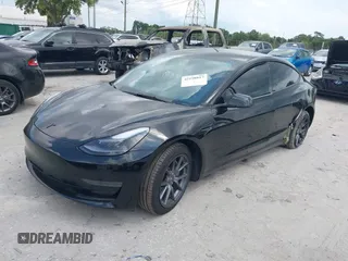 2023 Tesla Model 3 z VIN 5YJ3E1EA0PF571330, wystawiony jako IAAI lot #42198817 z przebiegiem 39 682 mil mil oraz . Historia ofert i sprzedaży dostępna na DreamBid. Obrazek 17.