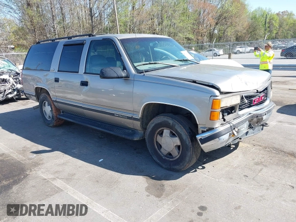 1999 GMC Suburban with VIN 3GKFK16R4XG514928, listed as a IAAI auction lot 41934636 with 245,010 mi miles and . Bid and sale history available at DreamBid. Image 1.