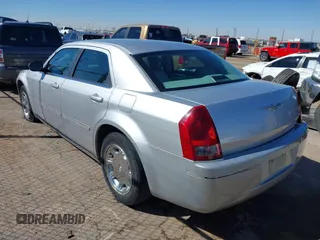 2006 Chrysler 300 Touring with VIN 2C3KA53G86H111027, listed as a IAAI auction lot 41870312 with 59,870 mi miles. Bid and sale history available at carsss.com. Image 3.