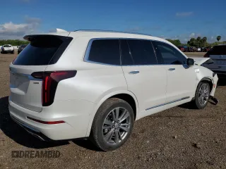 2023 Cadillac XT6 FWD Premium Luxury with VIN 1GYKPCRS5PZ120905, listed as a Copart auction lot 64374254 with 30,694 mi miles and Salvage title. Bid and sale history available at DreamBid. Image 3.