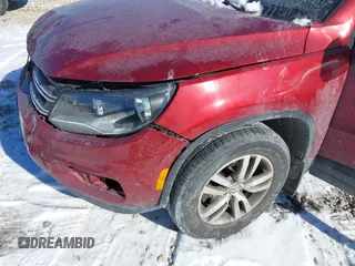 2013 Volkswagen Tiguan S with VIN WVGAV3AX2DW063067, listed as a IAAI auction lot 41638749 with 150,115 mi miles and . Bid and sale history available at DreamBid. Image 13.