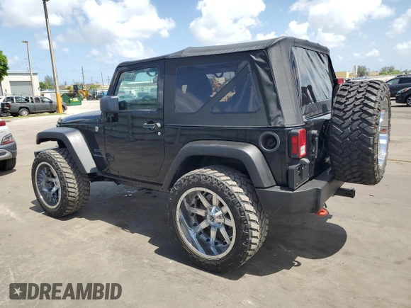 2014 Jeep Wrangler Sport with VIN 1C4AJWAG1EL200181, listed as a Copart auction lot 61165595 with 101,234 mi miles and Salvage title. Bid and sale history available at DreamBid. Image 2.