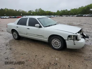 2003 Mercury Grand Marquis GS Convenience z VIN 2MEFM74W53X702387, wystawiony jako Copart lot #52852475 z przebiegiem 246 543 mil mil oraz Szkoda całkowita • Salvage title. Historia ofert i sprzedaży dostępna na DreamBid. Obrazek 4.
