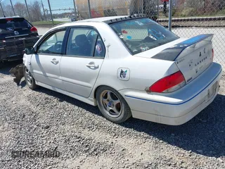 2002 Mitsubishi Lancer OZ-Rally with VIN JA3AJ86E42U039140, listed as a IAAI auction lot 41853888 with 328,181 mi miles. Bid and sale history available at carsss.com. Image 3.