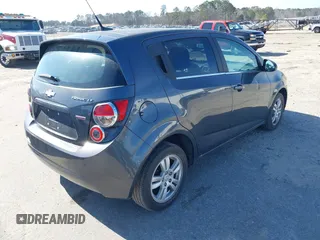 2013 Chevrolet Sonic LT with VIN 1G1JC6SB1D4164944, listed as a IAAI auction lot 41496975 with 96,987 mi miles. Bid and sale history available at carsss.com. Image 4.