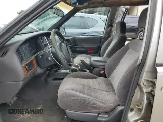 1998 Jeep Grand Cherokee Laredo with VIN 1J4FX58S7WC350624, listed as a Copart auction lot 63063624 with 0 mi miles and Salvage Title. Bid and sale history available at carsss.com. Image 7.