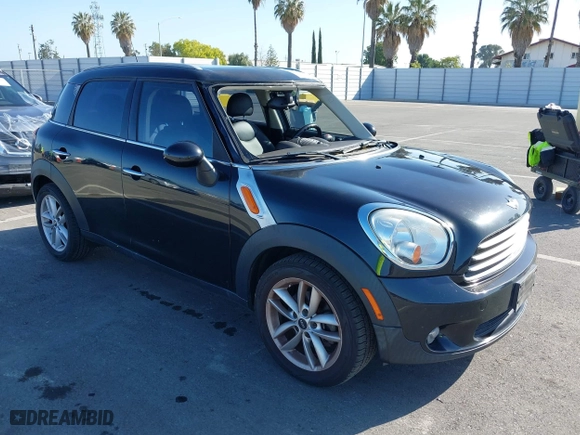 2013 MINI Cooper Countryman with VIN WMWZB3C52DWM07621, listed as a IAAI auction lot 42085389 with 153,714 mi miles. Bid and sale history available at carsss.com. Image 1.