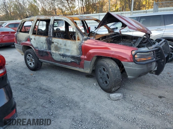 2002 Jeep Grand Cherokee z VIN 1J8GW38S72C159886, wystawiony jako Copart lot #77765704 z przebiegiem Nie podano mil oraz Szkoda całkowita • Salvage title. Historia ofert i sprzedaży dostępna na DreamBid. Obrazek 4.