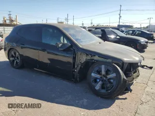 2024 BMW iX M60 with VIN WB533CF01RCR28341, listed as a Copart auction lot 69646904 with 1,753 mi miles and Salvage Title. Bid and sale history available at carsss.com. Image 4.