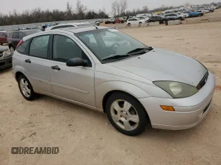 2004 Ford Focus with VIN 3FAFP37Z14R102723, listed as a Copart auction lot 44138195 with 220,354 mi miles and Salvage title. Bid and sale history available at DreamBid. Image 4.