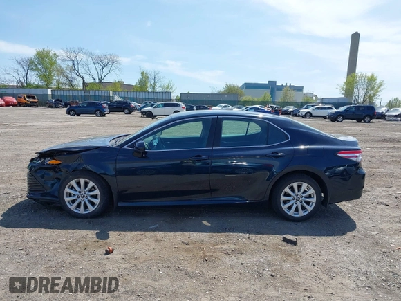 2019 Toyota Camry LE with VIN 4T1B11HK6KU276644, listed as a IAAI auction lot 42037249 with 23,677 mi miles and . Bid and sale history available at DreamBid. Image 14.
