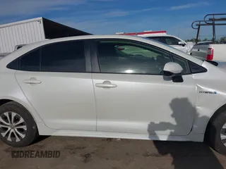 2020 Toyota Corolla Hybrid LE with VIN JTDEBRBE4LJ019579, listed as a IAAI auction lot 42024106 with 59,240 mi miles. Bid and sale history available at carsss.com. Image 14.