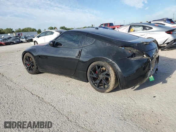 2014 Nissan 370Z z VIN JN1AZ4EH9EM636239, wystawiony jako Copart lot #69833264 z przebiegiem 110 802 mil mil oraz Szkoda całkowita • Salvage title. Historia ofert i sprzedaży dostępna na DreamBid. Obrazek 2.