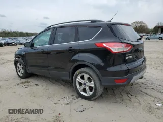 2016 Ford Escape SE with VIN 1FMCU9GX5GUB02417, listed as a Copart auction lot 51762985 with 97,535 mi miles and Salvage Title. Bid and sale history available at DreamBid. Image 2.