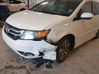 2015 Honda Odyssey Touring Elite with VIN 5FNRL5H97FB060060, listed as a IAAI auction lot 41829864 with Not Provided miles and . Bid and sale history available at DreamBid. Image 6.