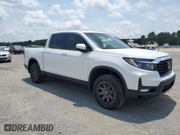 2023 Honda Ridgeline RTL-E with VIN 5FPYK3F7XPB027874, listed as a Copart auction lot 63771315 with 11,945 mi miles and Salvage title. Bid and sale history available at DreamBid. Image 4.