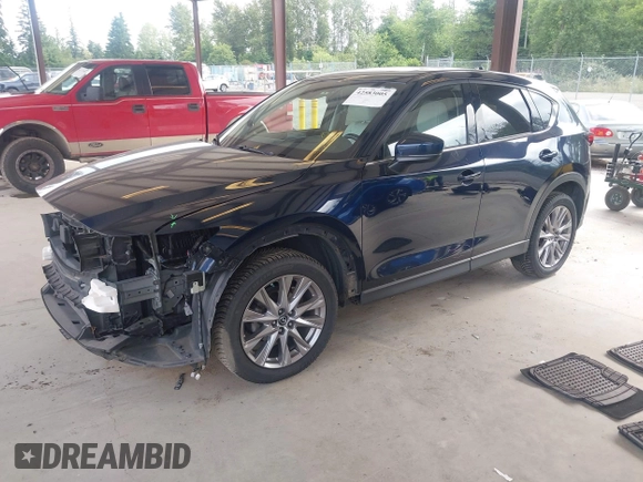 2019 Mazda CX-5 Grand Touring with VIN JM3KFBDM6K0522903, listed as a IAAI auction lot 42583005 with 61,174 mi miles and . Bid and sale history available at DreamBid. Image 18.