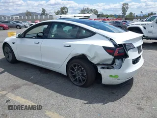 2023 Tesla Model 3 with VIN 5YJ3E1EA5PF502066, listed as a IAAI auction lot 41934960 with 17,926 mi miles and . Bid and sale history available at carsss.com. Image 3.