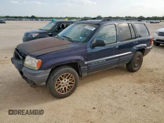 2004 Jeep Grand Cherokee with VIN 1J8GX58J54C121513, listed as a Copart auction lot 59384005 with 221,397 mi miles and Salvage title. Bid and sale history available at DreamBid. Image 1.