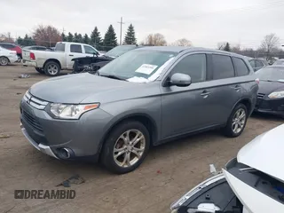 2015 Mitsubishi Outlander SE with VIN JA4AZ3A39FZ007936, listed as a IAAI auction lot 41003206 with 136,017 mi miles and . Bid and sale history available at DreamBid. Image 2.