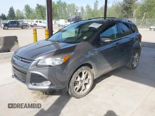 2014 Ford Escape Titanium with VIN 1FMCU9JX0EUC45801, listed as a IAAI auction lot 42121561 with 80,217 mi miles and . Bid and sale history available at DreamBid. Image 2.