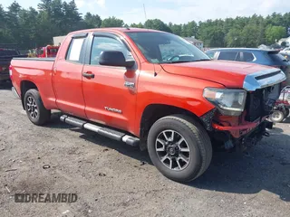 2018 Toyota Tundra SR with VIN 5TFUY5F18JX704415, listed as a IAAI auction lot 42561852 with 74,061 mi miles and . Bid and sale history available at DreamBid. Image 1.
