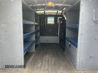 2013 Ford Econoline Cargo Commercial with VIN 1FTNE1EW6DDA61832, listed as a IAAI auction lot 42615381 with 111,015 mi miles and . Bid and sale history available at DreamBid. Image 10.