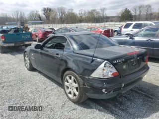 1999 Mercedes-Benz SLK-Class with VIN WDBKK47F2XF102927, listed as a Copart auction lot 50265585 with 184,918 mi miles and Salvage Title. Bid and sale history available at carsss.com. Image 2.