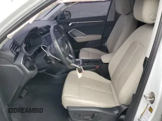 2020 Audi Q3 S line Premium z VIN WA1DECF31L1122011, wystawiony jako Copart lot #50725195 z przebiegiem 47 567 mil mil oraz Szkody całkowita. Historia ofert i sprzedaży dostępna na DreamBid. Obrazek 7.
