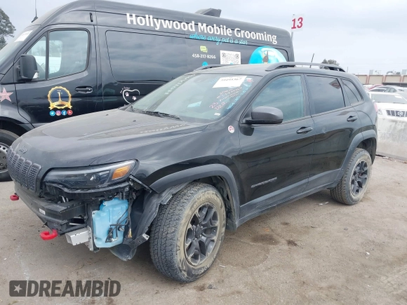 2019 Jeep Cherokee Trailhawk with VIN 1C4PJMBX6KD232515, listed as a IAAI auction lot 39495367 with 53,293 mi miles and . Bid and sale history available at DreamBid. Image 2.